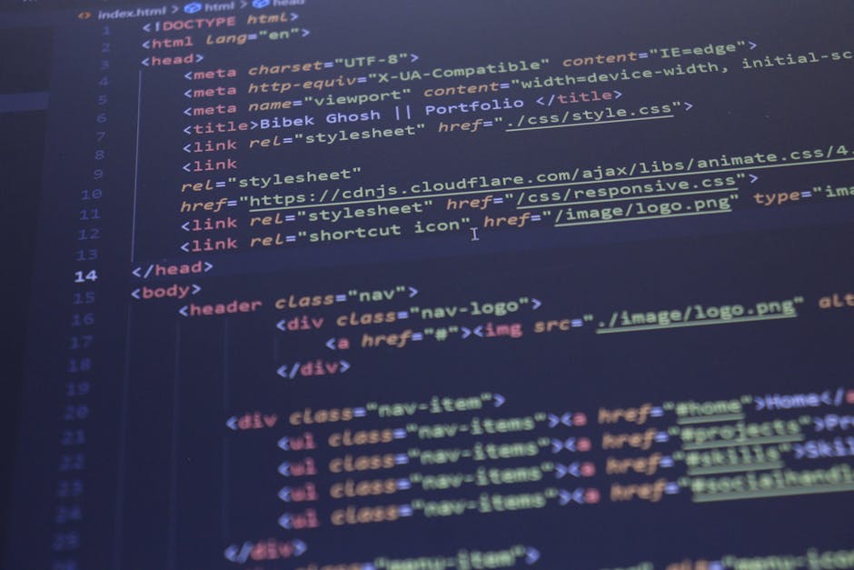 A close-up image of a computer screen displaying lines of blurred, multicoloured programming code in various shades of red, blue, green, yellow, and white. The text appears to include functions, varia